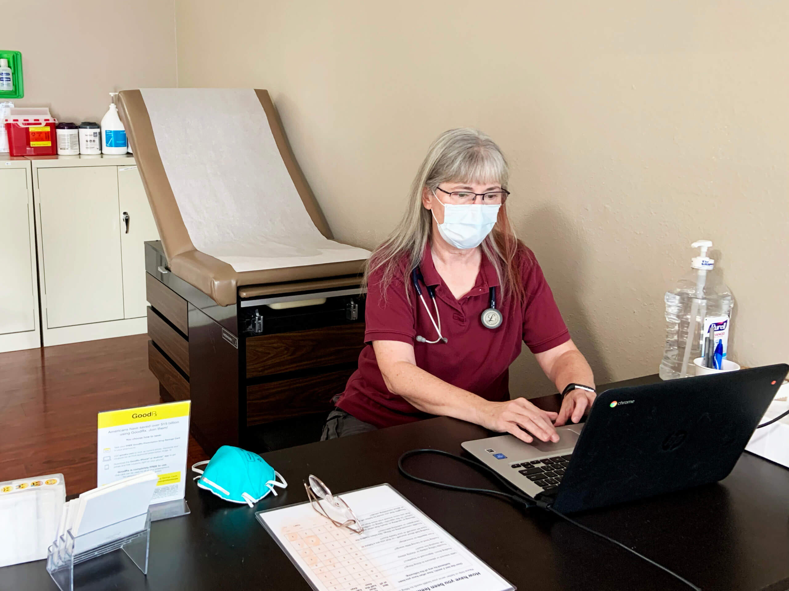 Lead care provider Pat Buckley prepares to greet the next medically-vulnerable patient at the new Hansen Clinic location