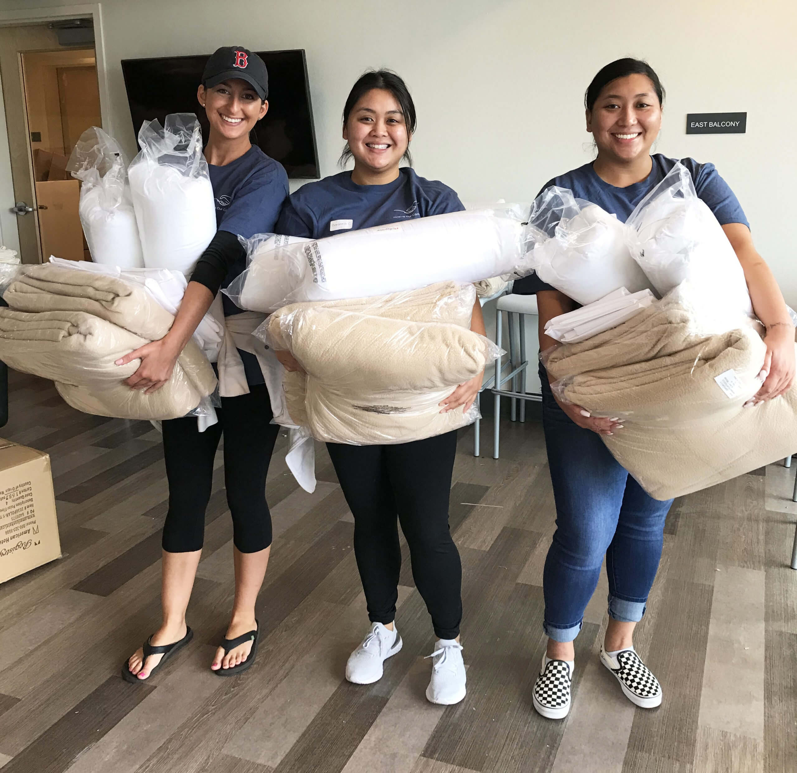 Group of volunteers with fresh bedding products