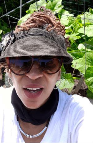 Close up image of Cheryl Cruz in garden