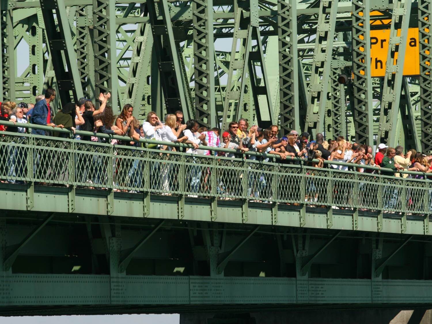 People standing on bridge