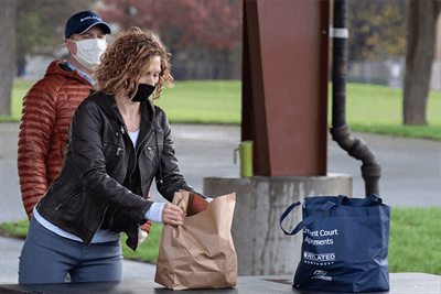 Image of Rachel Maas with brown paper bag