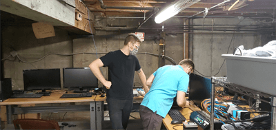 Help Desk Specialist Will Wheatley-Uhl and IT Manager Matt Petrie configure hardware to increase capacity for remote work.