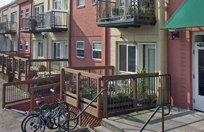 Exterior of Rose Wood Apartments showing decks of apartments
