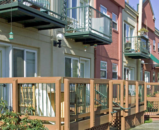 Exterior of Rose Wood Apartments showing decks of apartments