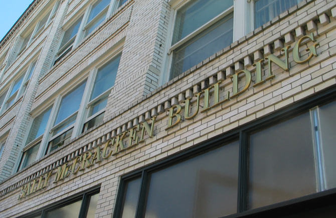 Exterior closeup of Sally McCracken Apartments building sign